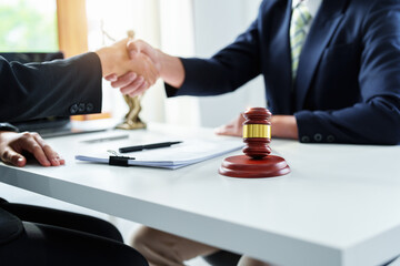 Wall Mural - Law, consultation, agreement, contract, lawyer or attorney shakes hands to agree on the client's offer to be hired to fight the parties in court.