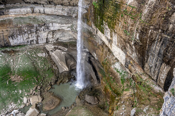 waterfall in a high mountain gorge in the mountains of Dagestan