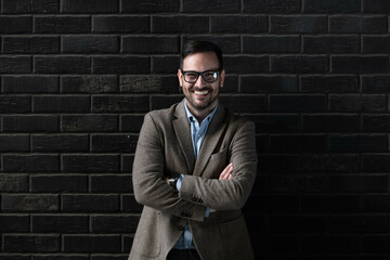 Wall Mural - Portrait of a young businessman in contrast lights
copy space