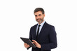 Businessman using tablet and looking at camera on white background
