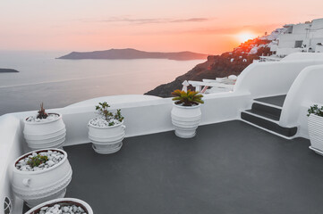 Wall Mural - Beautiful sunset at Santorini island, Greece. White architecture with sea view. Summer travel and vacations concept