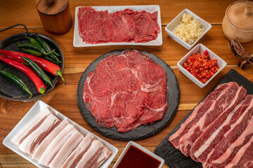 Wall Mural - Mixed fresh Beef and pork belly set for BBQ grilling with Kimchi, fresh vegetables, fresh chili and dipping sauce, Korean BBQ.