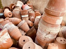 A Pile Of Used Clay Flower Pots