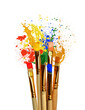 © New Africa - Different brushes and paint splatters on white background