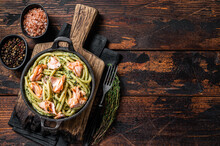 Salmon Bucatini Pasta With Creamy Spinach Sauce And Fish Fillet. Wooden Background. Top View. Copy Space