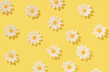 Spring creative layout with white flowers on bright yellow background. 80s, 90s retro romantic aesthetic bloom concept. Minimal fashion idea.