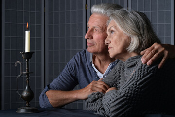 Sticker - Senior couple in love looking away at home