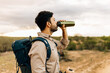 Man hiking with backpack and water bottle in Brazilian Caatinga