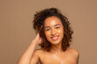 © Cultura Creative - Portrait of smiling woman with curly hair