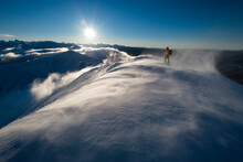 Mountaineer Standing On Orhi Mountain Peak In Winter, Pyrenees, Navarre, Spain
