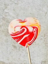 Close-Up Of A Multi Coloured Heart Shaped Lollipop