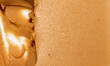 Brown peanut paste made from whole nuts.The texture of peanut paste top view.Peanut butter background.