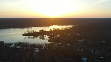 Beautiful Sunrise Over Waterfront Lake Houses With Colorful Sun Glowing And Reflecting At Highland Reservoir Grand Lake O' The Cherokees In Midwest Oklahoma - Aerial Drone Shot