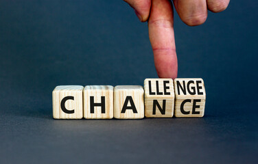 chance or challenge symbol. businessman turns wooden cubes and changes the concept word challenge to