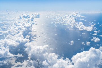 Wall Mural - aerial view of sea and clouds on a sunny day