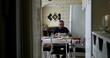 © Marco - Lonely older man eating lunch alone in home kitchen