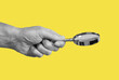 Magnifying glass in man hand on yellow background. Information search and analysis concept. Conducting check. High quality photo