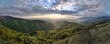 High angle aerial view drone image of sunset sun rays trough the trees and forest in mountain range in autumn or winter day - Babin Zub Old Mountain in Serbia - Travel journey and vacation concept