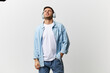 © SHOTPRIME STUDIO - Tired unhappy frustrated tanned handsome man in casual basic t-shirt headphones listen awful song posing isolated on over white studio background. Copy space Banner Mockup. Cool playlist concept