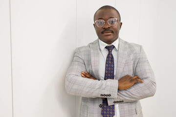 portrait of a successful african businessman with glasses in a suit