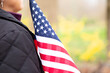 Close up of woman holding American flag