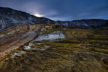 A Full Moon Rises Over Mammoth Hot Springs In Yellowstone Nation