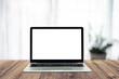 © suriya - Laptop Computer blank screen on wood table with office background, mockup template for your text,