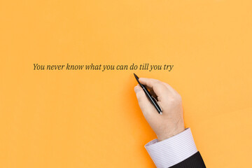 Handwritten quote on an orange background