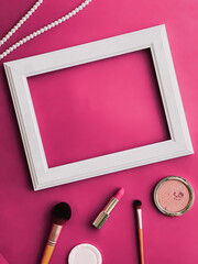 Wall Mural - White horizontal art frame, make-up products and pearl jewellery on pink background as flatlay design, artwork print or photo album