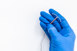Fototapeta  - T-shaped intrauterine contraceptive device in gynecologist hand