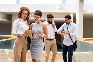 Group of young business people working and communicating at the office