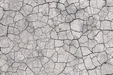 Surface Of A Grungy Dry Cracking Parched Earth For Textural Background.