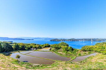 初夏の犬頭の棚田と鷹島肥前大橋　佐賀県唐津市　Inugashira Rice Terraces in early summer and Takashima Hizen bridge. Saga-ken Karatsu city.