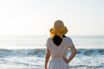 Wall Mural - Young woman having a rest on the beach.