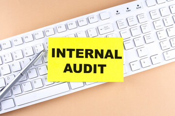 Poster - Text INTERNAL AUDIT text on a sticky on keyboard, business concept
