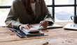 © David - Businesswoman working at office with documents on his desk, doing planning analyzing the financial report, business plan investment, finance analysis concept