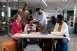 © wavebreak3 - Happy multiracial male and female advisors discussing together during meeting in boardroom