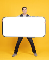 Poster - Phone mock up. Happy man with smartphone. Big phone mock up on yellow. Cellphone for your advertising. Phone with blank white screen. Places for mobile offer. Big smartphone. Mock up for advertising