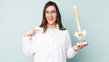 Young Pretty Woman  Feeling Happy And Pointing To Self With An Excited. Spine Specialist Concept