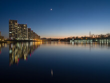 Night City. Houses Are Reflected In The Water. Siberian City Of Krasnoyarsk