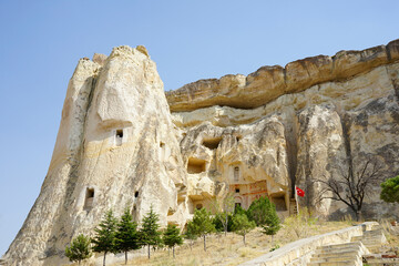 Wall Mural - Cavusin Church, where you can see the oldest rock-cut church in the region, is the old settlement. Cappadocia, Nevsehir, Turkey