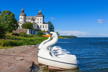 Poster - Beautiful view with pedal boats at the beach at Lacko castle in sweden