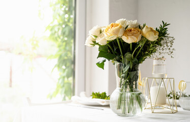 beautiful table setting for romantic dinner for two, roses bouquet copy space