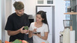 © Prathankarnpap - Healthy young Asian couple preparing healthy food together in kitchen.
