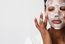 Close-up Of Woman Applies A Hydro Gel Face Mask. Skin Care And Beauty Treatments