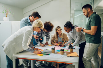 Wall Mural - Group of diverse business people working together and having a meeting