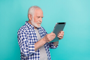 Sticker - Profile side photo of concentrated granddad addicted to online surfing social media isolated on teal color background