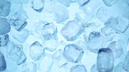 Aufkleber - Super slow motion of falling ice cubes separated on blue background. Filmed on high speed cinema camera, 1000 fps.
