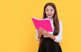 Fototapeta  - Happy girl child read school textbook yellow background, reading