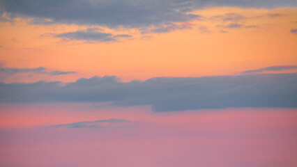 Wall Mural - pink orange sky with clouds at beautiful sunset as natural background.